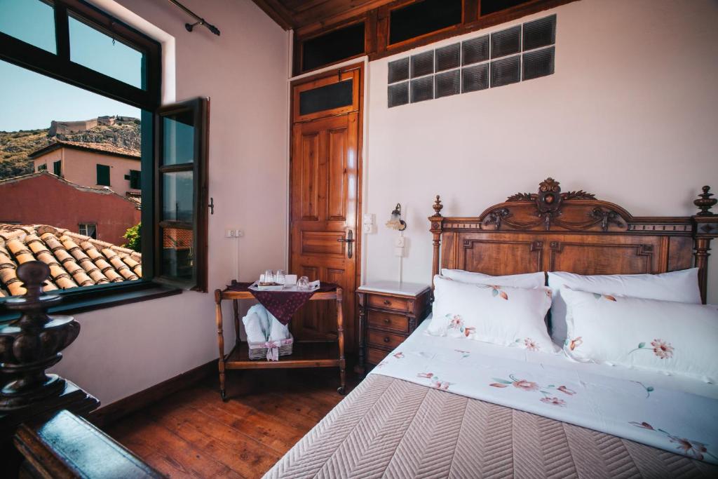 Postel nebo postele na pokoji v ubytování Rigas Pension Nafplio