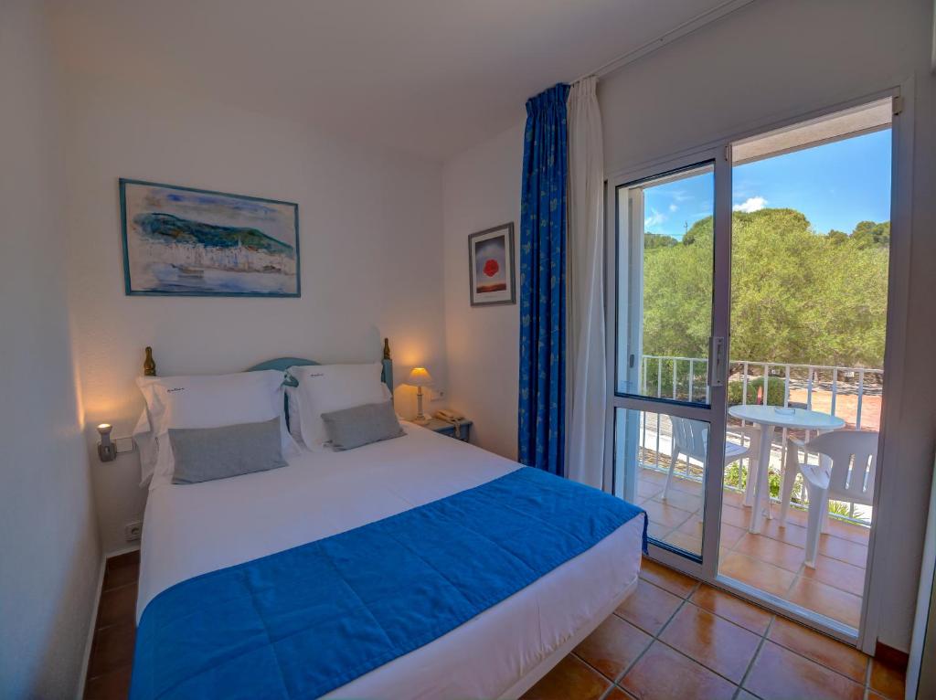 Postel nebo postele na pokoji v ubytování Hotel Calina