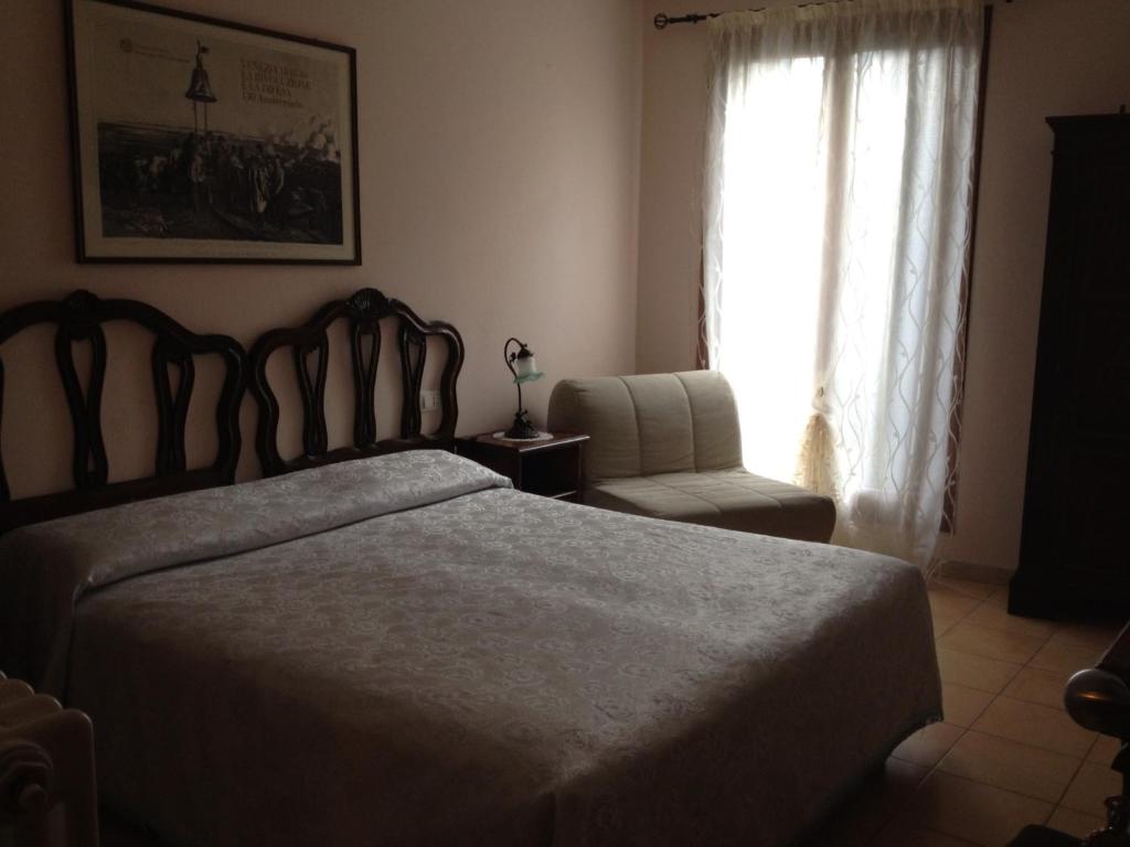 Postel nebo postele na pokoji v ubytování Hotel Locanda Salieri