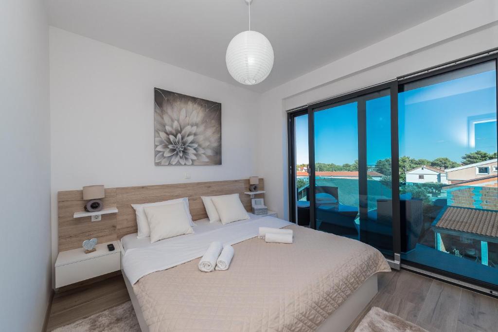 Posteľ alebo postele v izbe v ubytovaní Luxury Apartments VilaMaloca