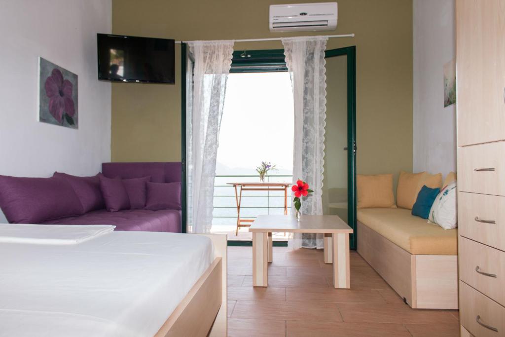 Postel nebo postele na pokoji v ubytování Elina Apartments