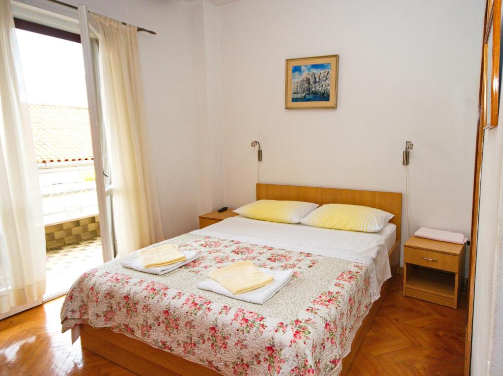 Postel nebo postele na pokoji v ubytování Rooms Ivka