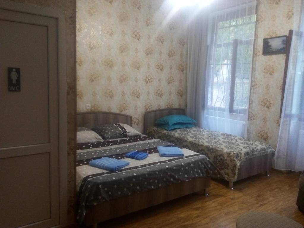 Llit o llits en una habitació de Best Host