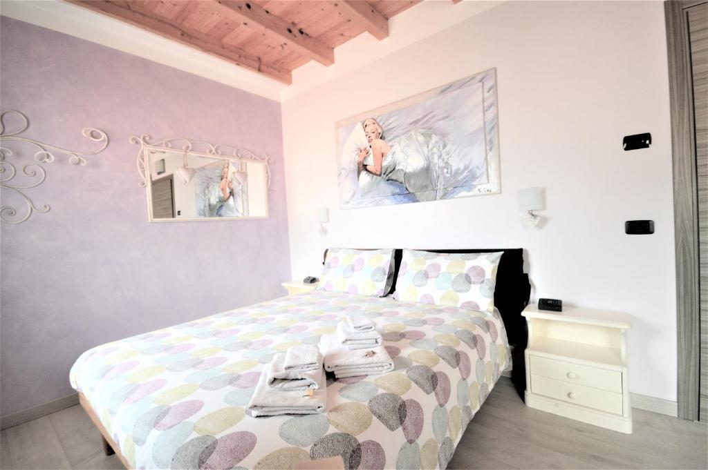 Postel nebo postele na pokoji v ubytování B&B La Vecchia Tipografia - Lago D'Idro