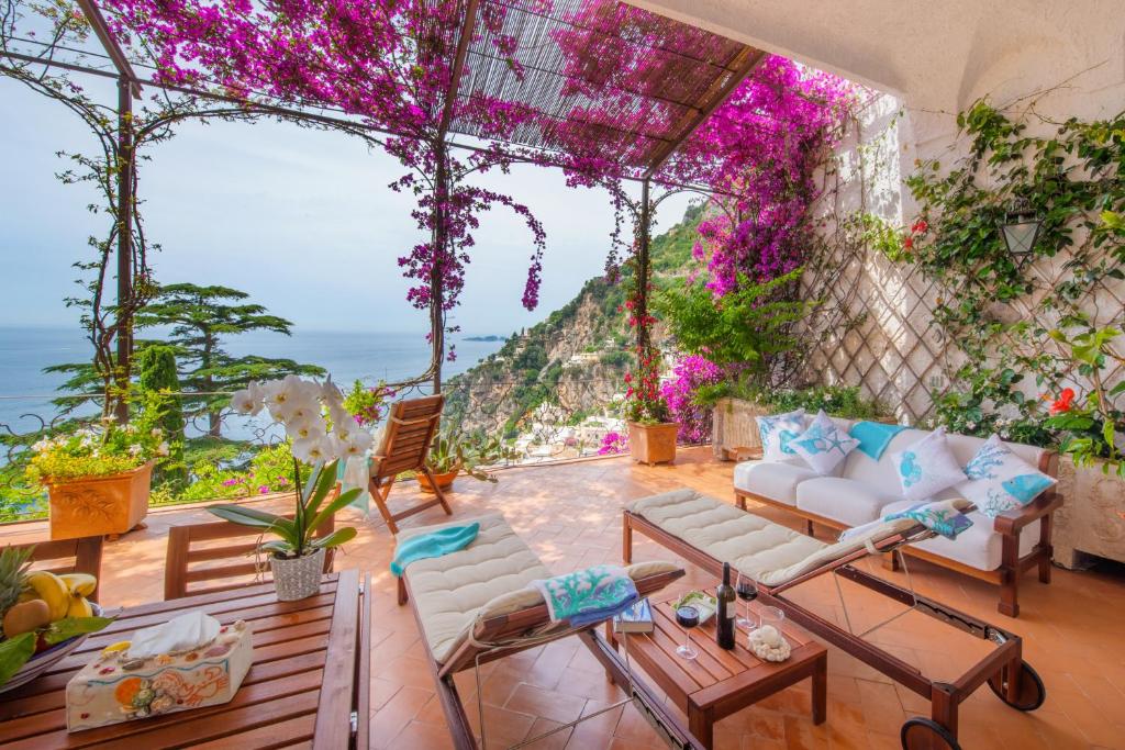 a living room with a view of the ocean at Casa Passalacqua in Positano