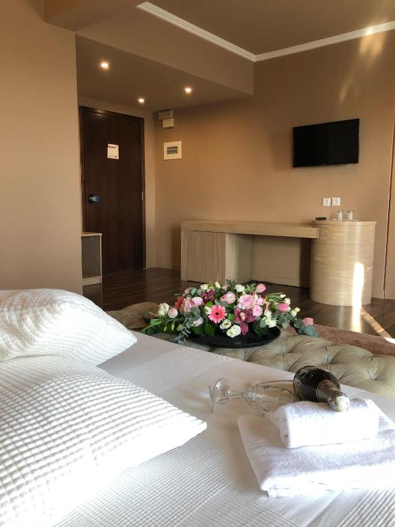 Postel nebo postele na pokoji v ubytování Galaxy Hotel