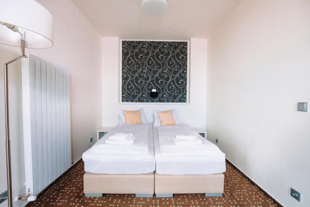 Postel nebo postele na pokoji v ubytování K-Triumf Resort