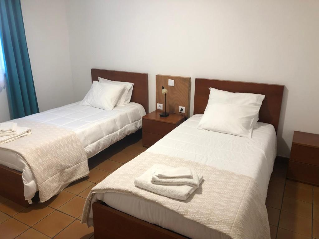 Postel nebo postele na pokoji v ubytování Casas do Verdelho