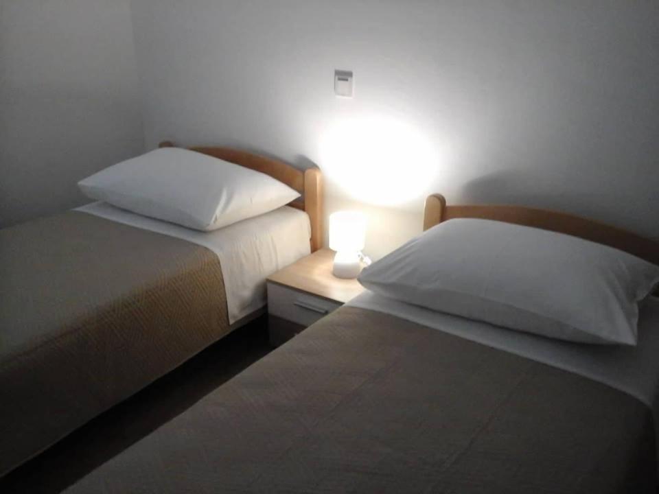 Postel nebo postele na pokoji v ubytování Krešo i Niko
