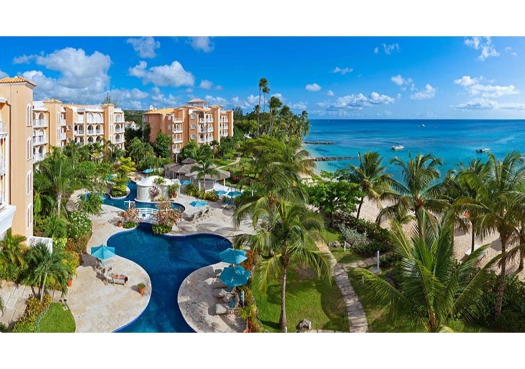 an aerial view of a resort with a pool and the ocean at St Peter's Bay Luxury Resort and Residencies in Saint Peter