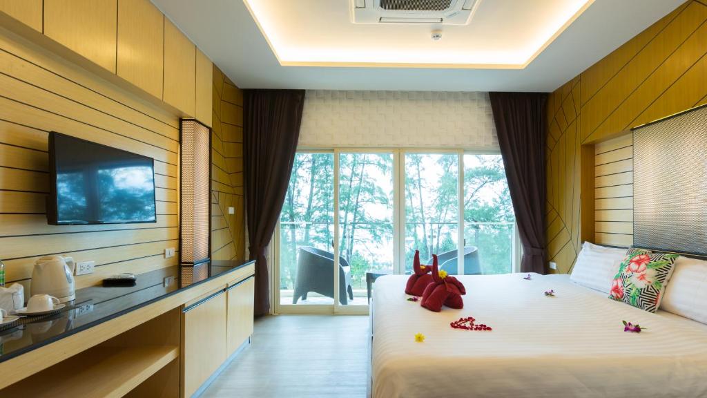 Postel nebo postele na pokoji v ubytování Anda Beachside Hotel