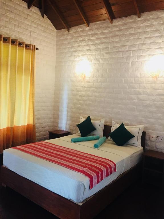 Postel nebo postele na pokoji v ubytování Liyon Rest sigiriya
