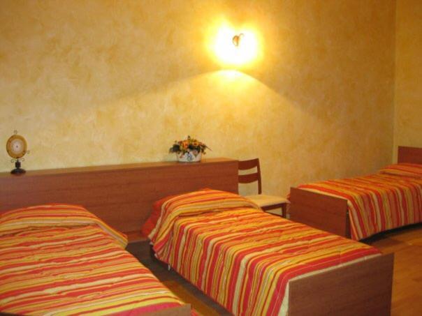 Ένα ή περισσότερα κρεβάτια σε δωμάτιο στο B&B COLLE DI CONDRO