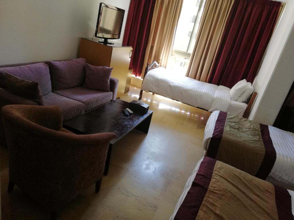 Postel nebo postele na pokoji v ubytování Bliss 3000 Furnished Studios