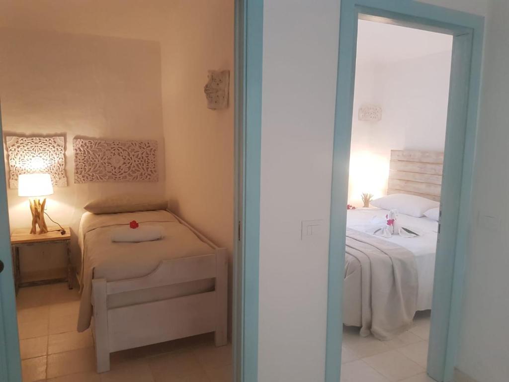 Łóżko lub łóżka w pokoju w obiekcie Residence Capraggia