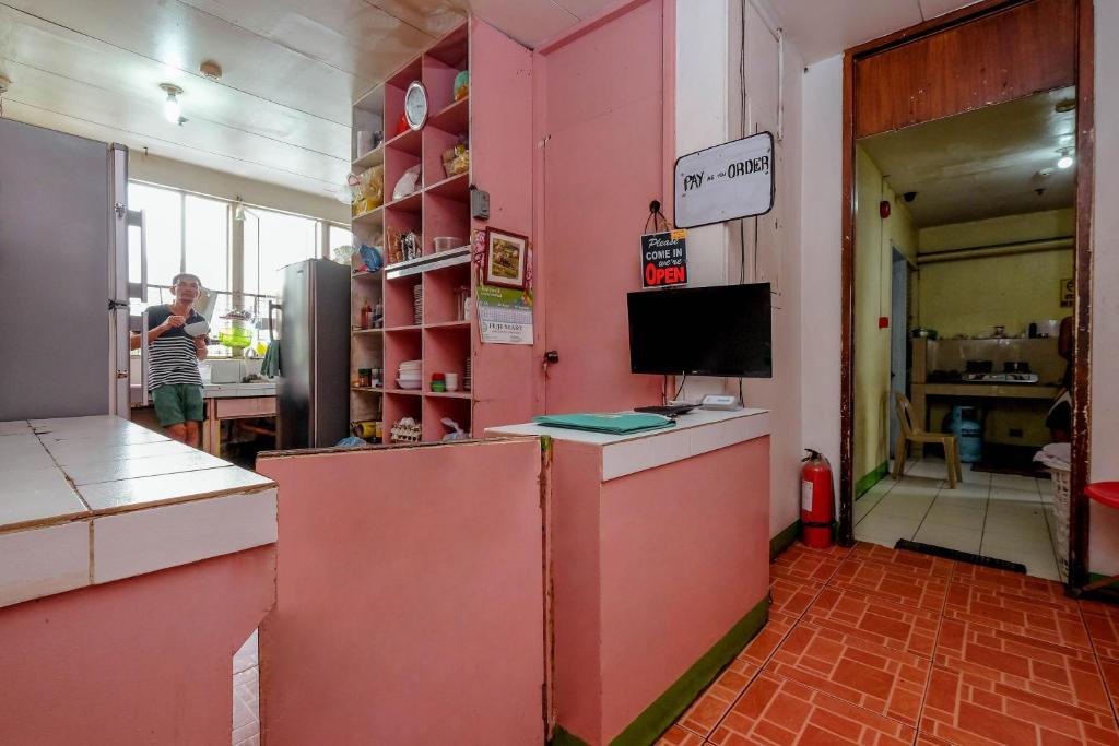Kuchyň nebo kuchyňský kout v ubytování Stay Malate (Wanderers Guest House)