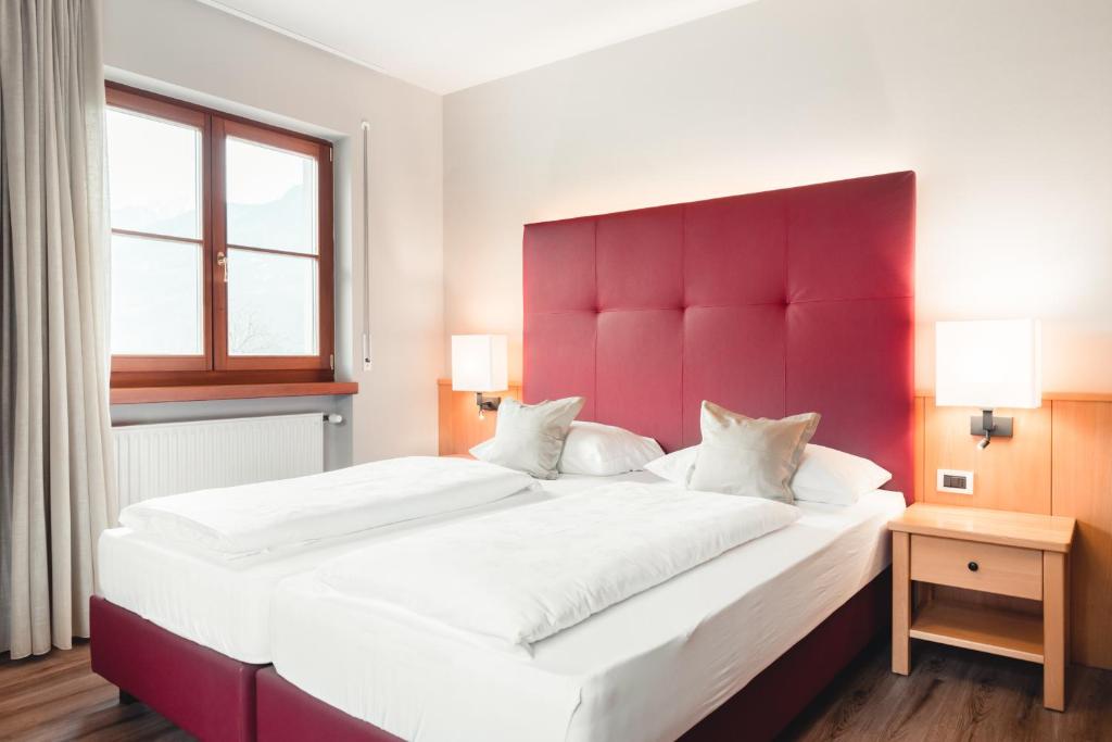 Postel nebo postele na pokoji v ubytování Hotel Tiefenbrunn Gardensuites & Breakfast