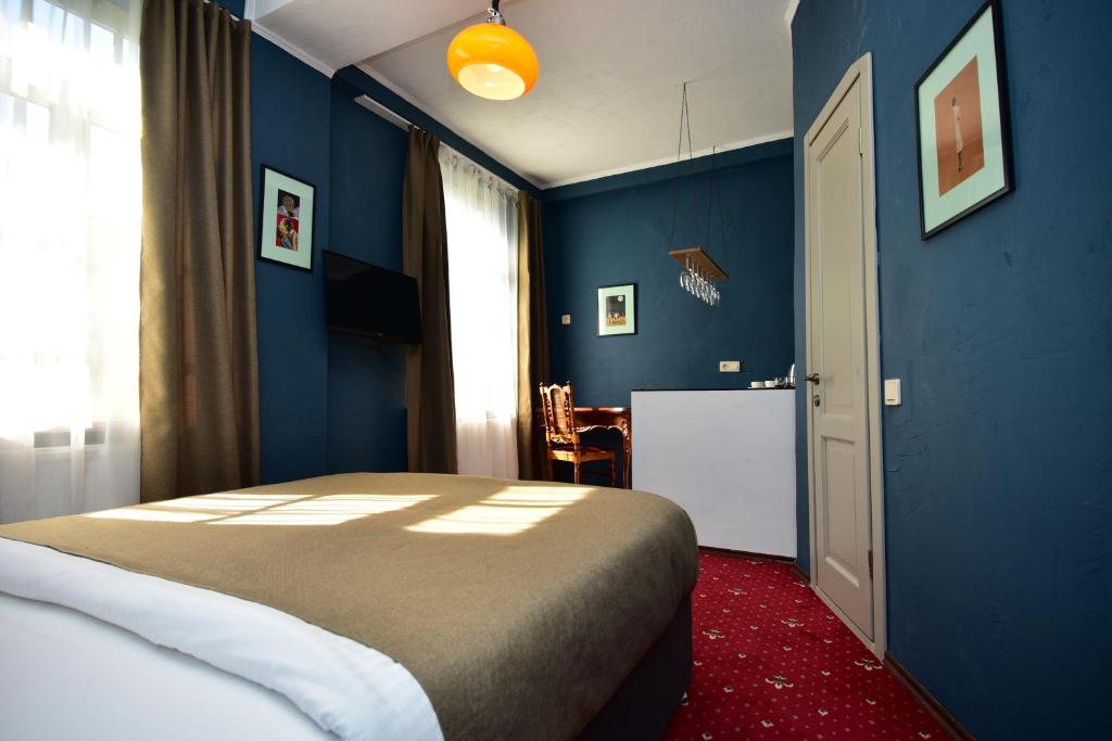Кровать или кровати в номере Kindli Hotel