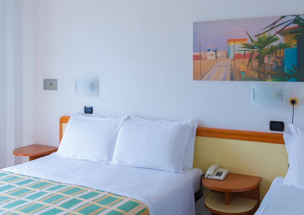 Postel nebo postele na pokoji v ubytování Hotel Sultano