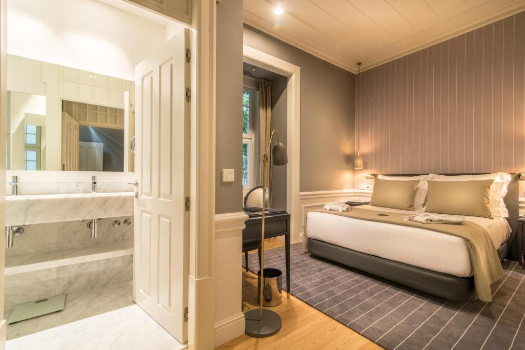 Postel nebo postele na pokoji v ubytování Hotel da Baixa