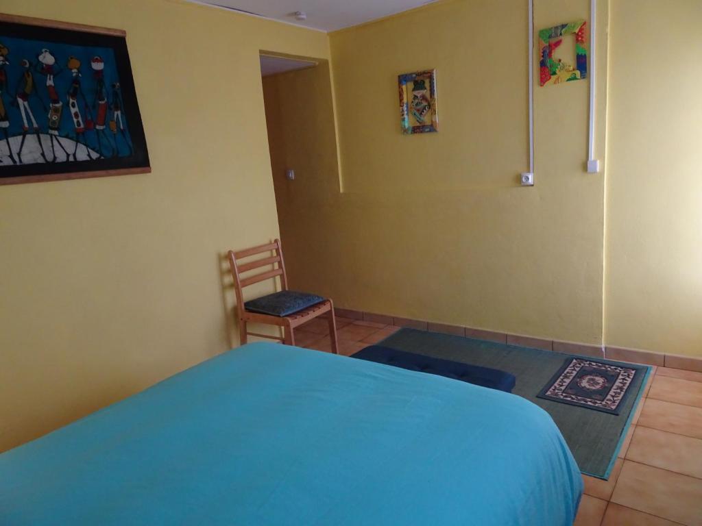 Postel nebo postele na pokoji v ubytování Relais du Volcan