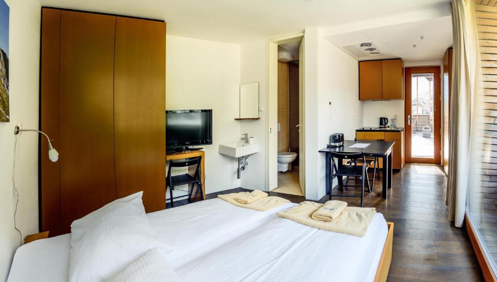 Postel nebo postele na pokoji v ubytování Hotel Sanje ob Soči ***/****