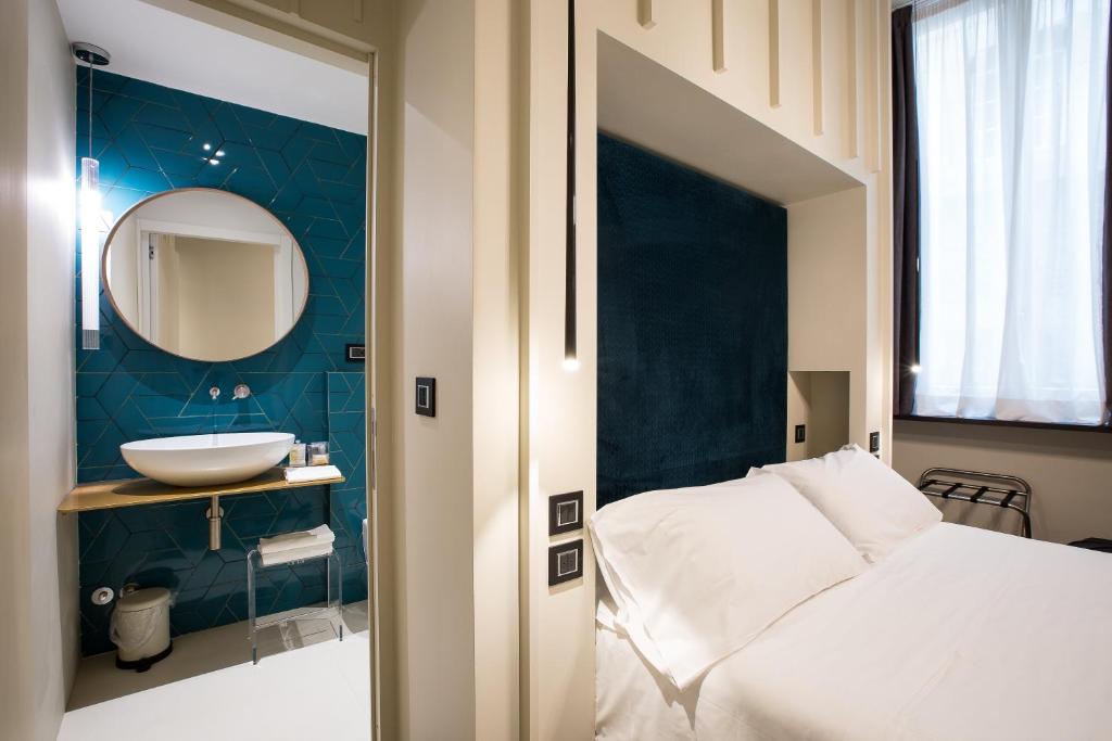 Postel nebo postele na pokoji v ubytování Hotel Silla