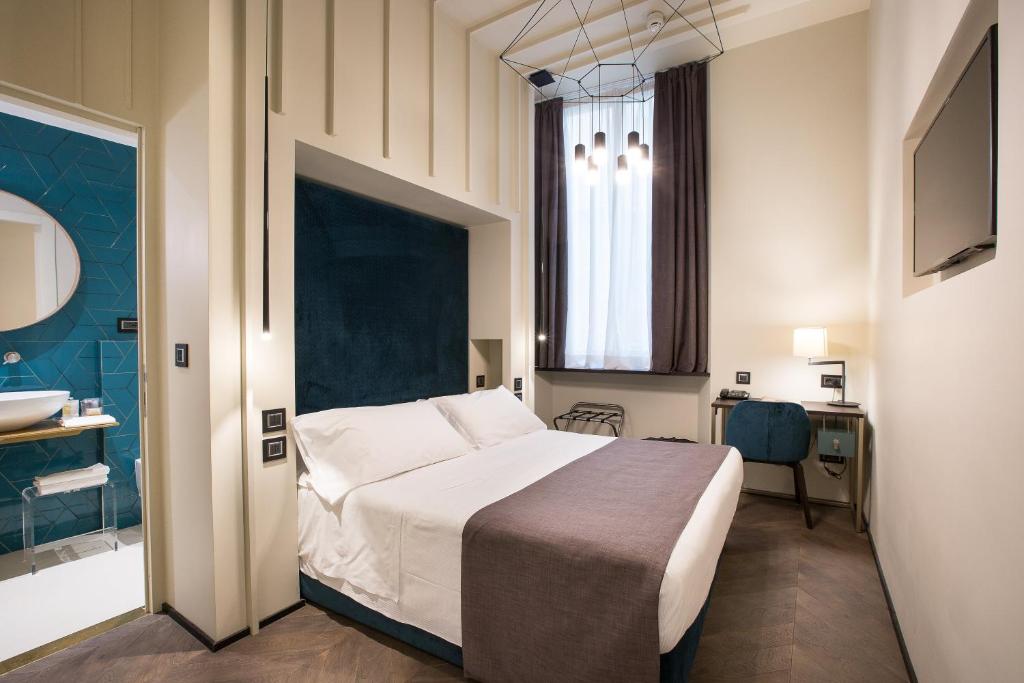 Postel nebo postele na pokoji v ubytování Hotel Silla