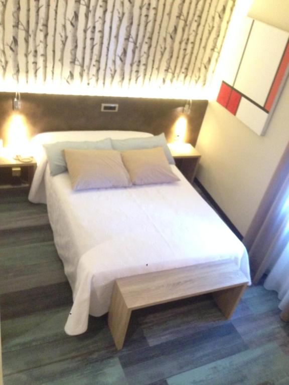 Postel nebo postele na pokoji v ubytování Hotel Oriente