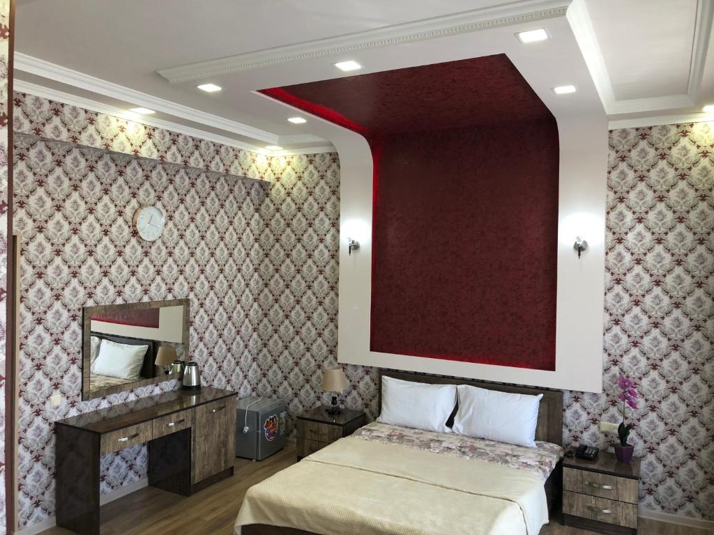 Postel nebo postele na pokoji v ubytování Hotel Felisa Gyumri