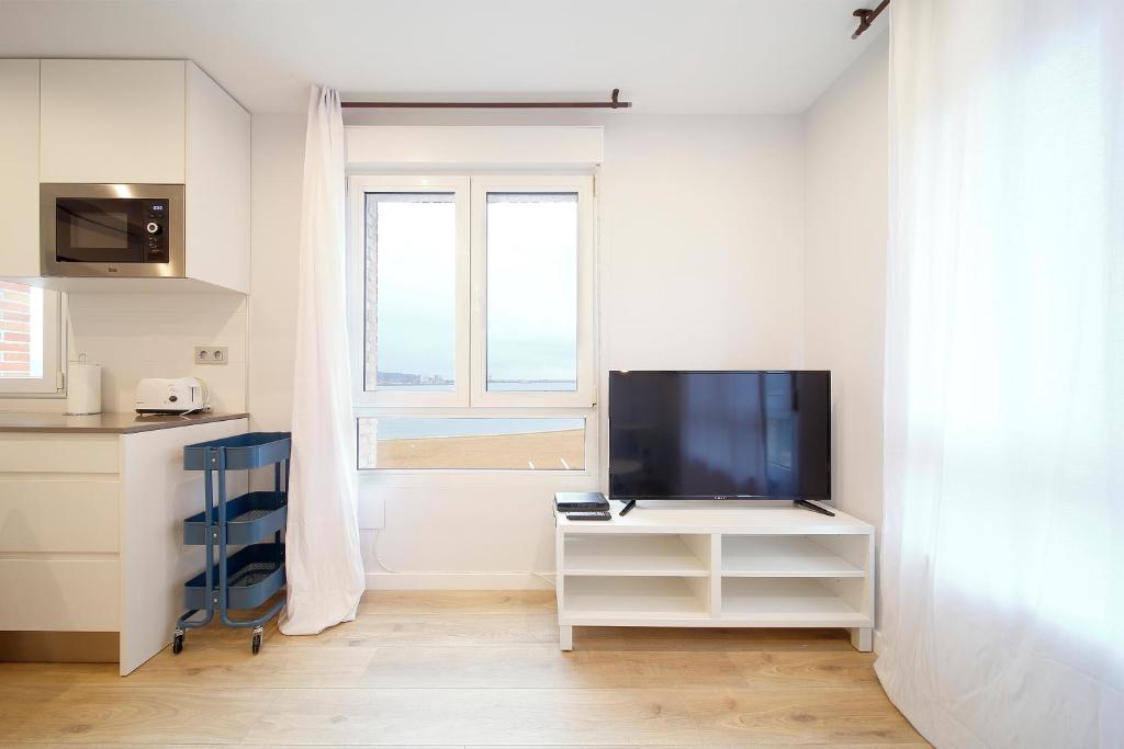 TV a/nebo společenská místnost v ubytování Mirador a Poniente