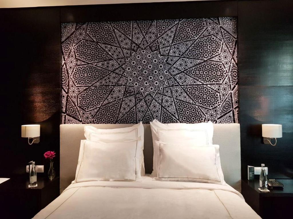 Letto o letti in una camera di ODYSSEE Boutique Hotel Casablanca