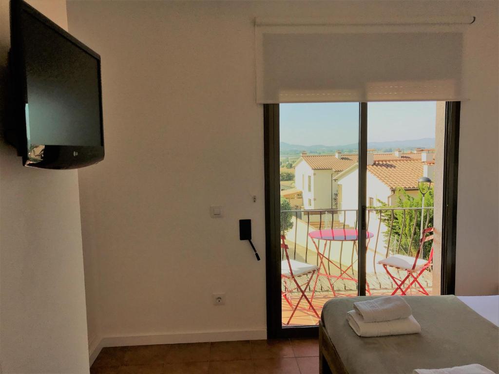 Televízia a/alebo spoločenská miestnosť v ubytovaní Empordà Residencial