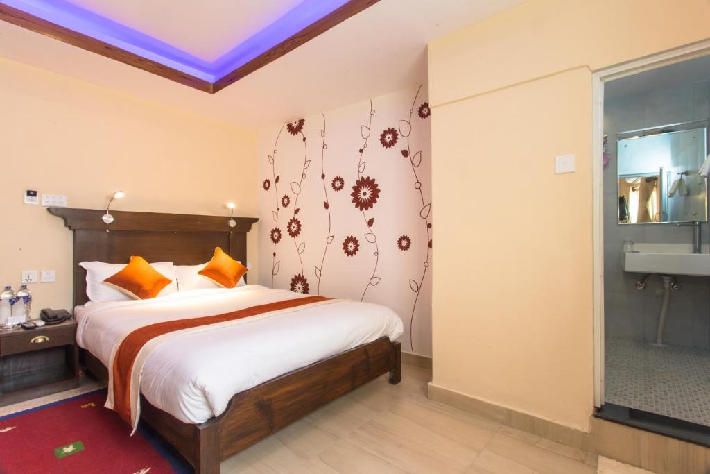 Llit o llits en una habitació de Hotel Beijing Lu