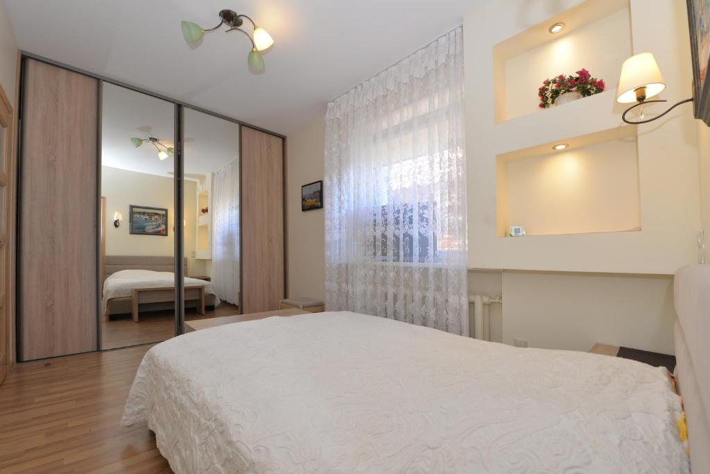 Postel nebo postele na pokoji v ubytování Nida guesthouse at Loreta