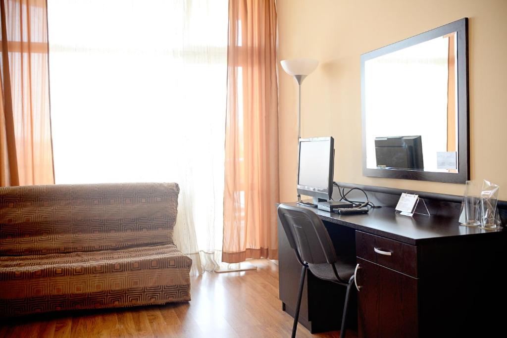 TV a/nebo společenská místnost v ubytování Family Art-Hotel Zora