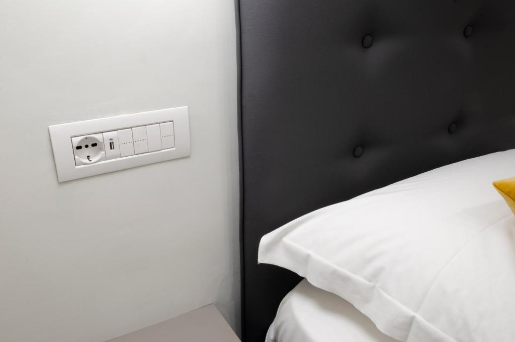 Postel nebo postele na pokoji v ubytování Napoli Svelata