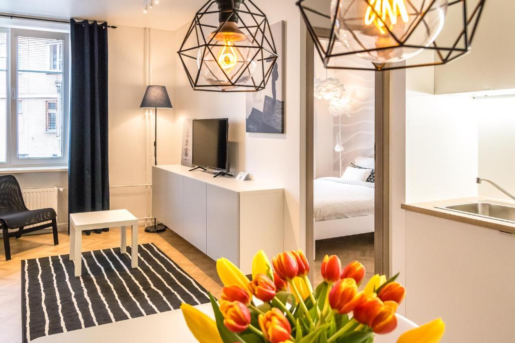 a room with a living room with a bedroom at No.3 Apartment Link-To-Happiness in Klaipėda