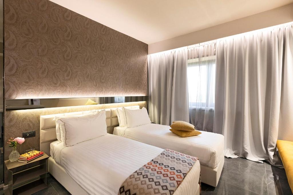 Postel nebo postele na pokoji v ubytování Albavilla Hotel & Co
