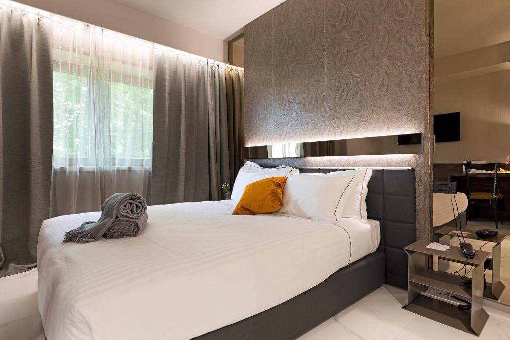 Postel nebo postele na pokoji v ubytování Albavilla Hotel & Co