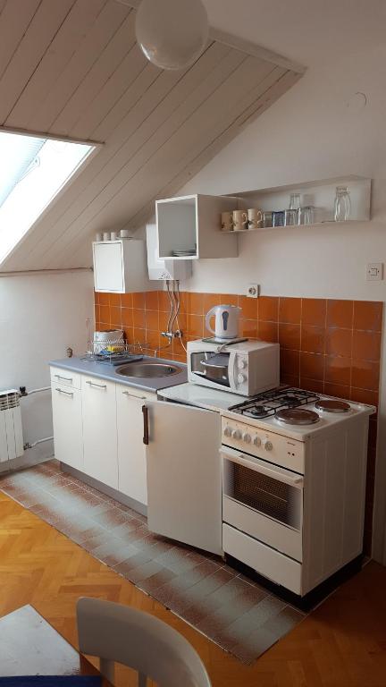 Kuchyň nebo kuchyňský kout v ubytování Apartment Central