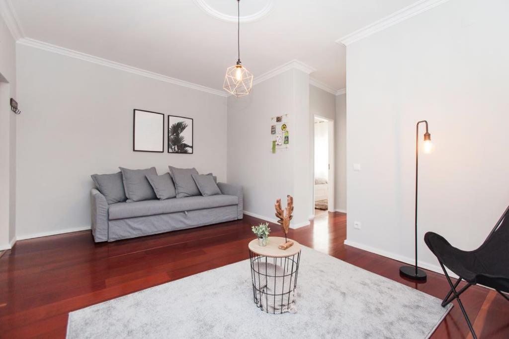 a living room with a couch and a table at Barbara's House - Minho's Guest in Braga