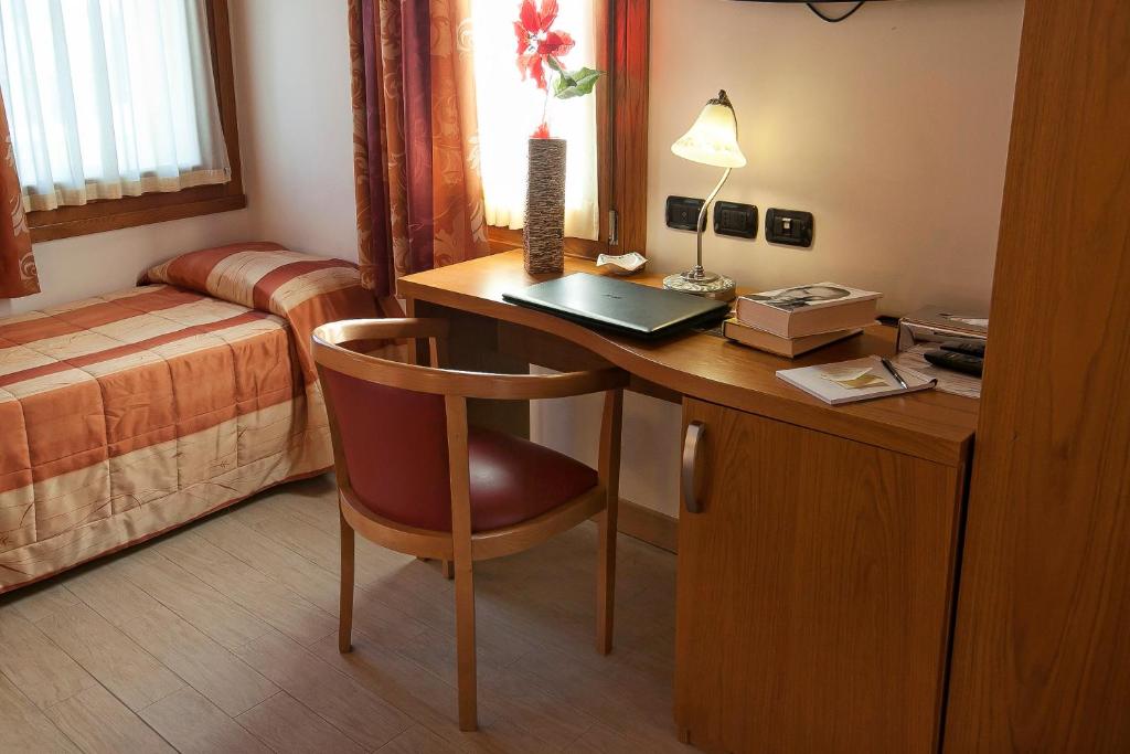 Postel nebo postele na pokoji v ubytování Albergo Antica Corte Marchesini