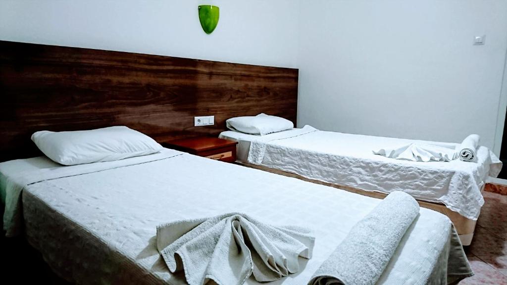Postel nebo postele na pokoji v ubytování Simge Pension