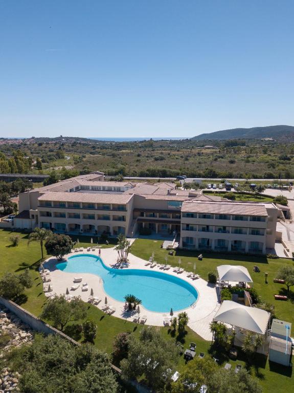 an aerial view of a resort with a swimming pool at Hotel San Teodoro in San Teodoro