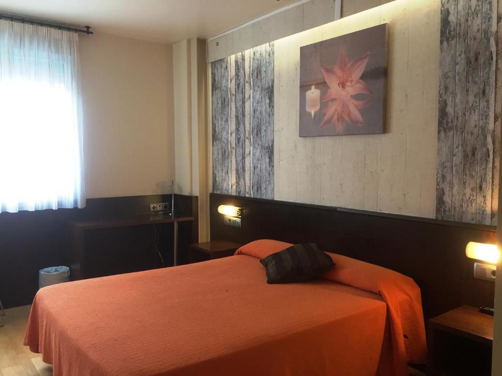 Postel nebo postele na pokoji v ubytování Hostal Nirvana