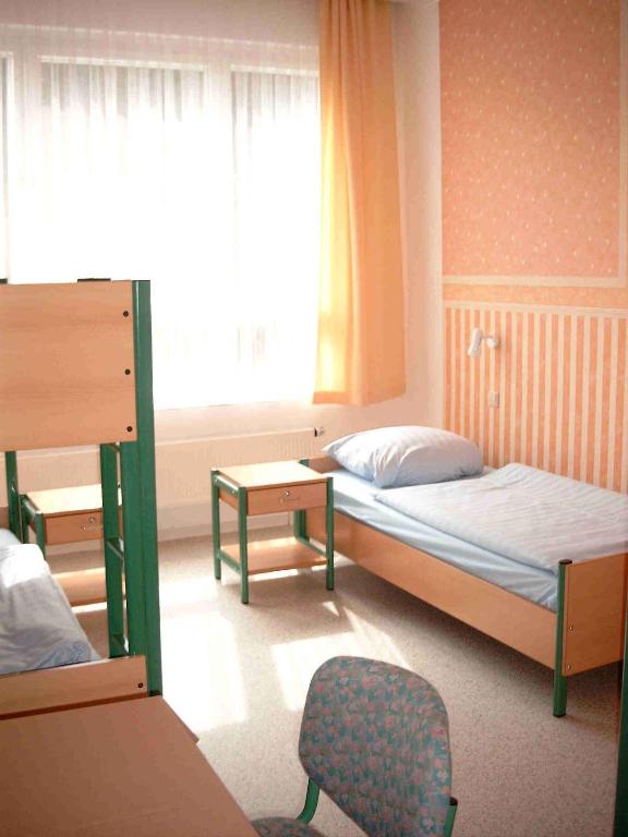 Postel nebo postele na pokoji v ubytování Internationales Gästehaus