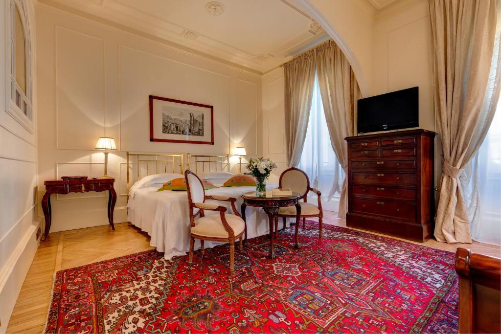 TV a/nebo společenská místnost v ubytování Grand Hotel Plaza