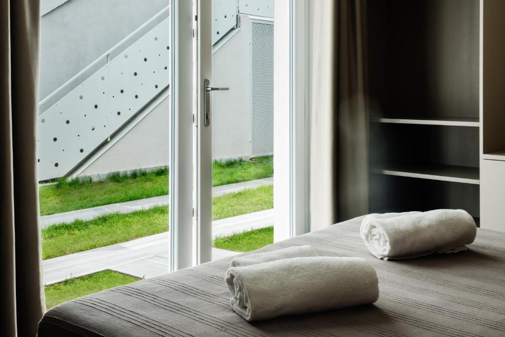 Postel nebo postele na pokoji v ubytování Garda Guest House