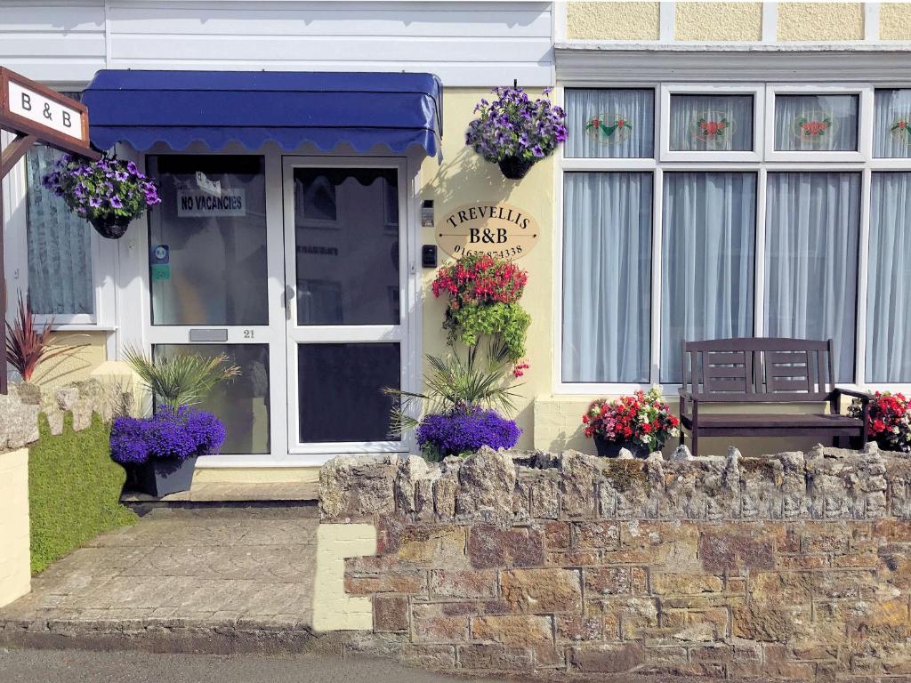 a house with flowers on the front of it at Trevellis Bed and Breakfast in Newquay